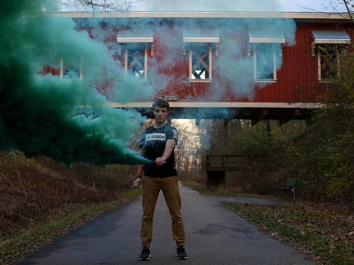 human person surrounded by green smoke people