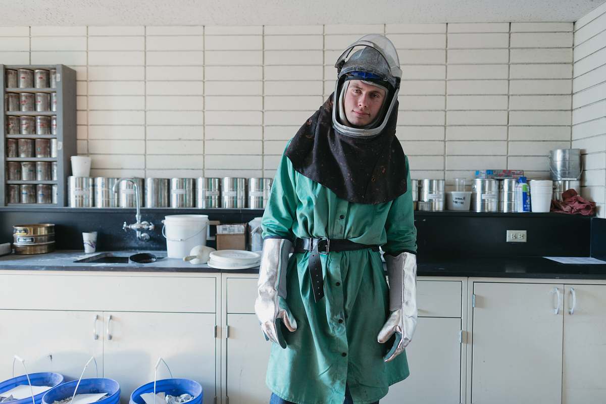 people person wearing suit inside white painted room human