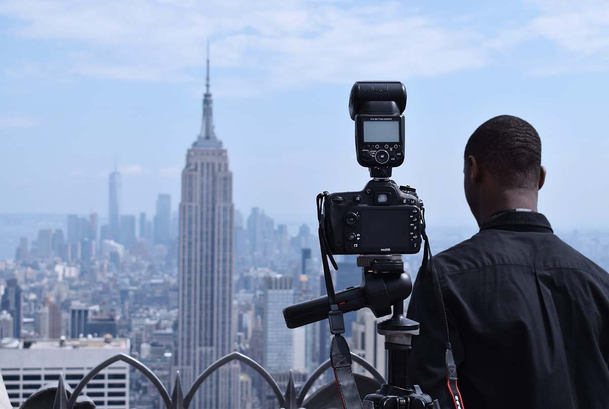 people photographer taking photo of building human