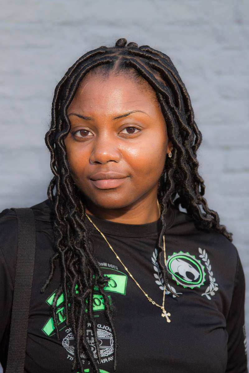 human portrait photography of woman wearing black shirt and gold necklace people