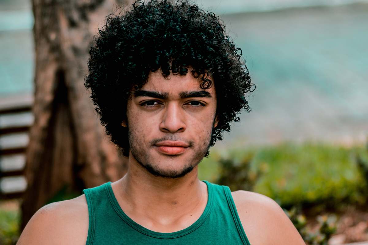 people selective focus photo of man wearing green tank top human