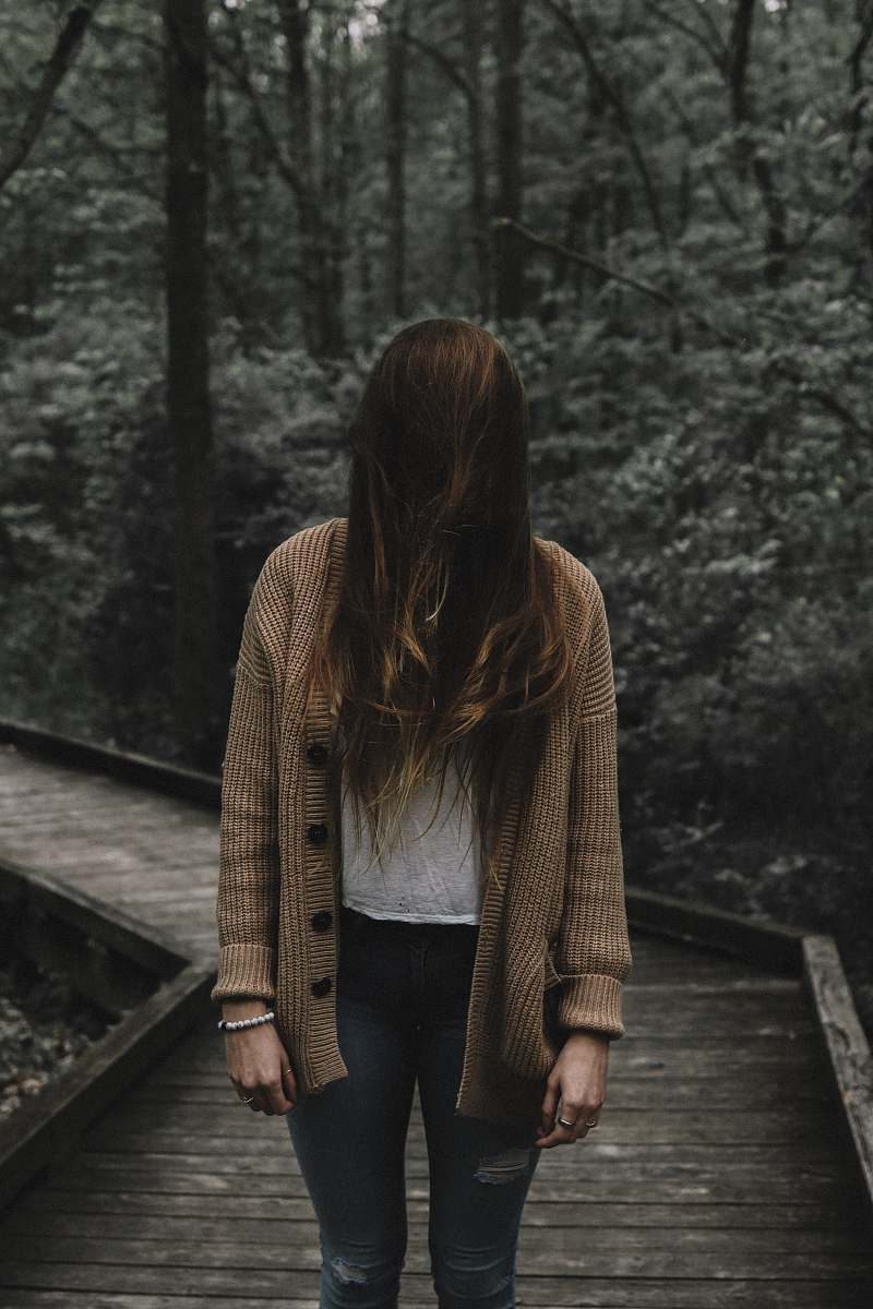 human selective focus photo of woman standing on dock people