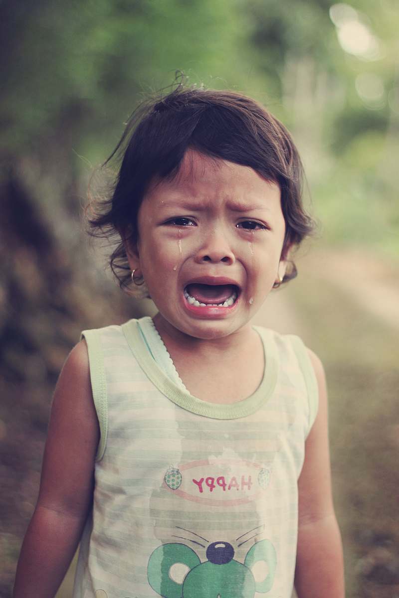 human selective focus photography of girl crying people