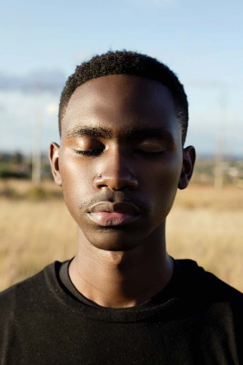 people selective focus photography of man closing his eyes human