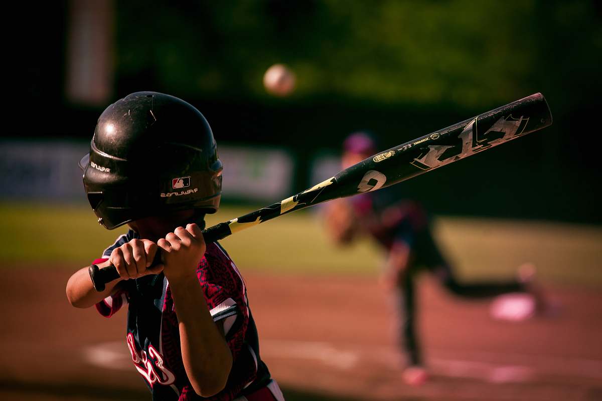 people selective focus photography of person holding baseball bat human