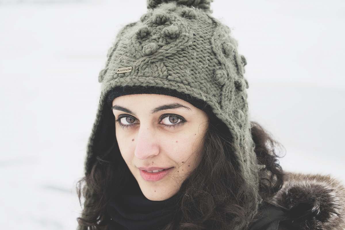 woman selective focus photography of woman in gray knitted hat face