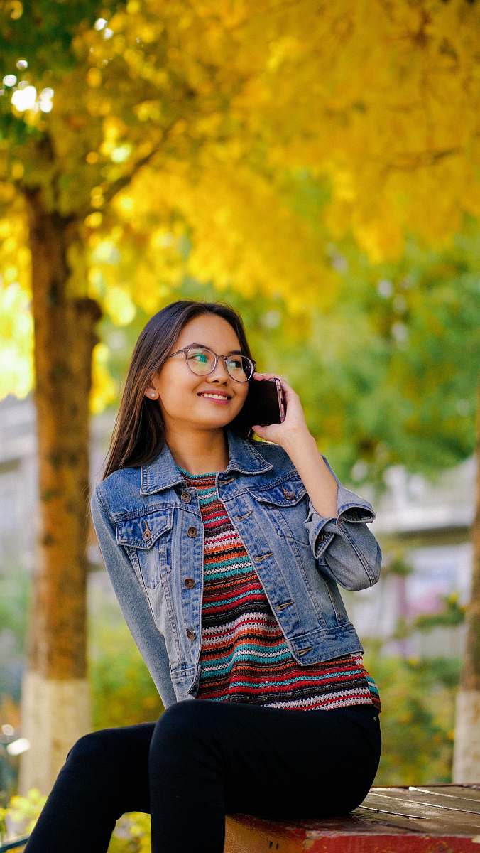 human shallow focus photo of woman in blue denim button-up jacket people