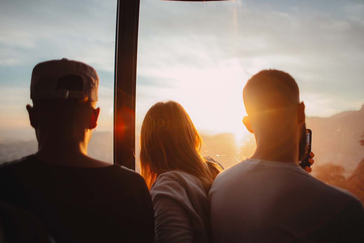 people three people standing each other during golden time human