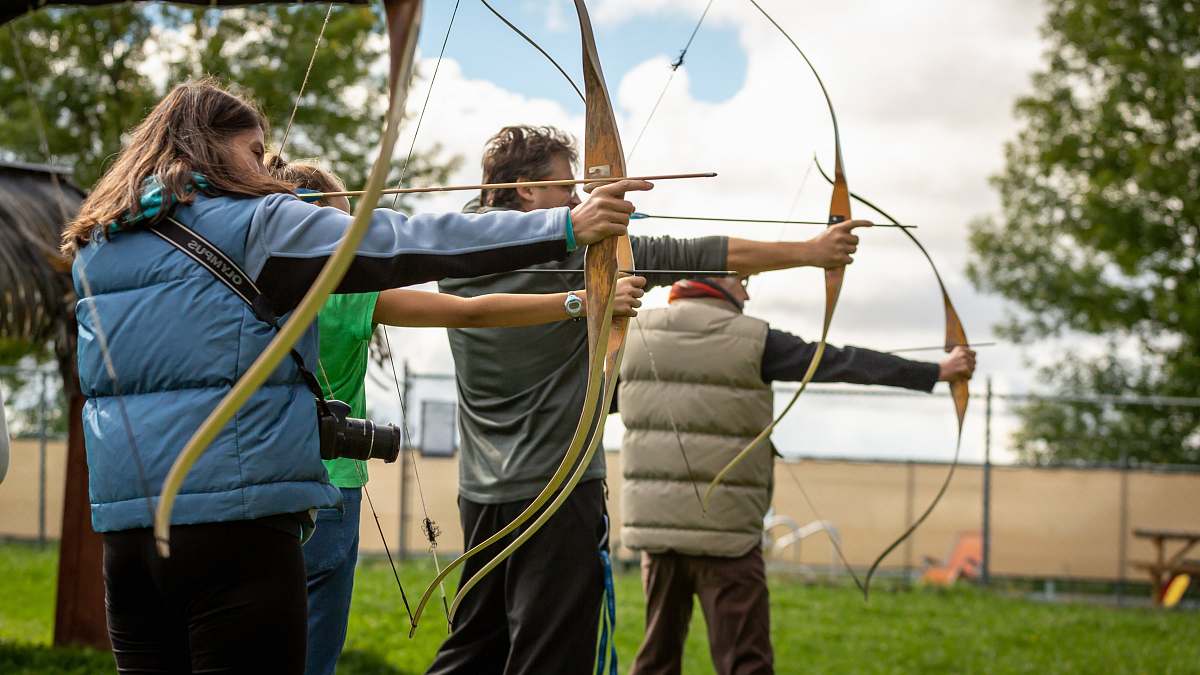 People Three Person Practicing Using Arrow Human Image Free Photo