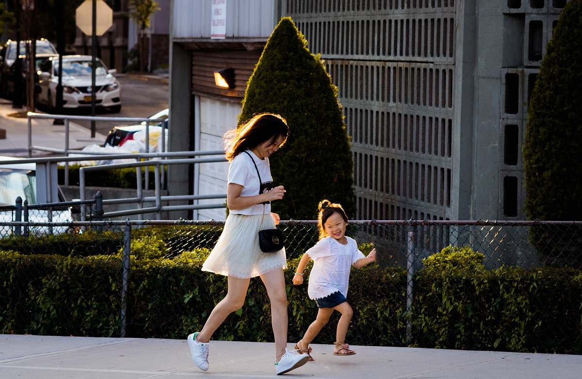 people time lapse photography of man and girl running car