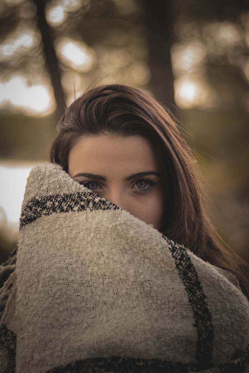 people woman covering her face with brown cloth human