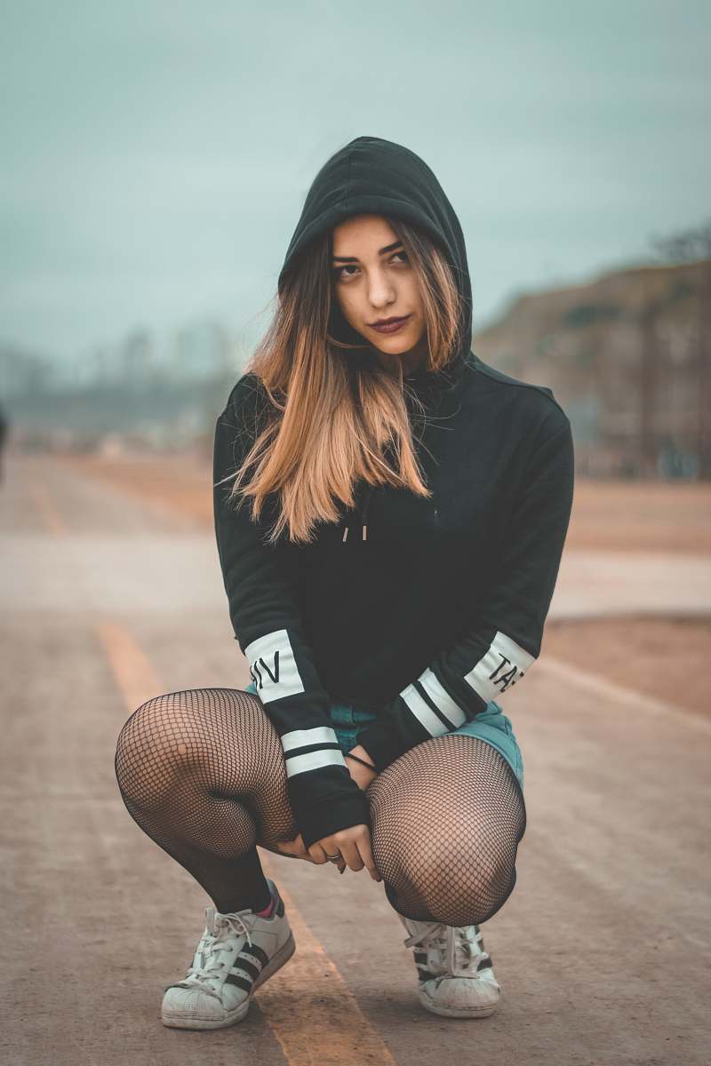 human woman crouch on road people