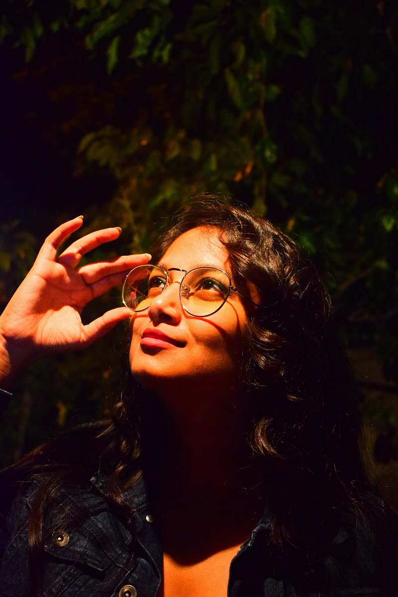 human woman holding her eyeglasses people
