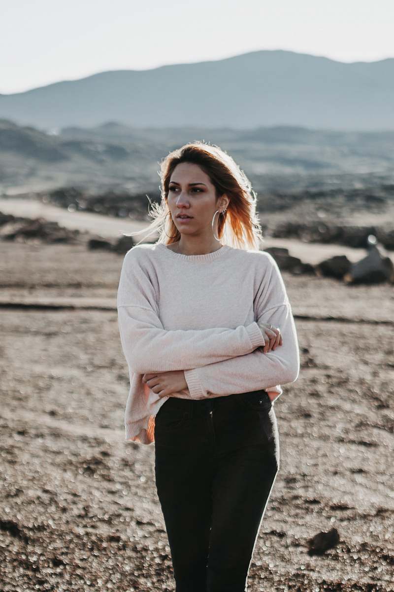 human woman in beige top and black tops on brown soil during daytime people