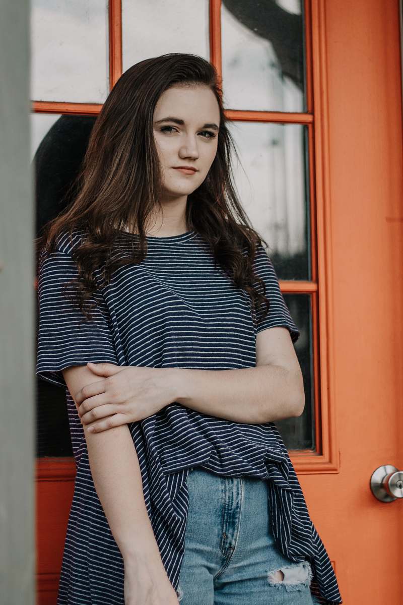 human woman in gray and black striped top people