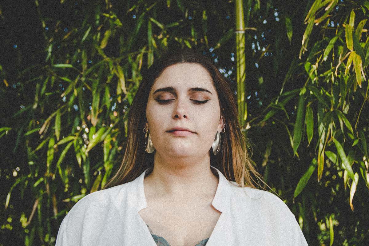 people woman in white top near green trees during daytime human