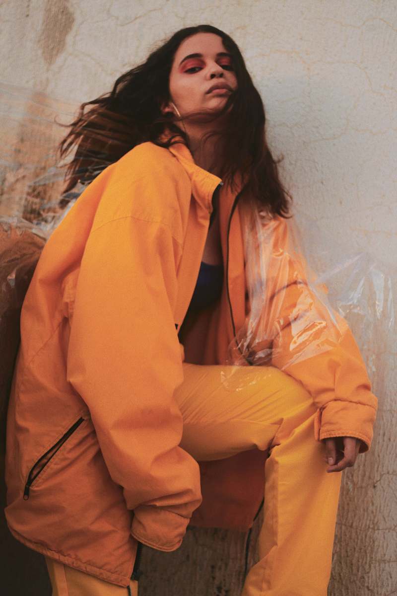human woman leaning beside wall people