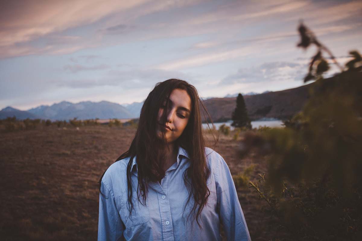 human woman posing near body of water people
