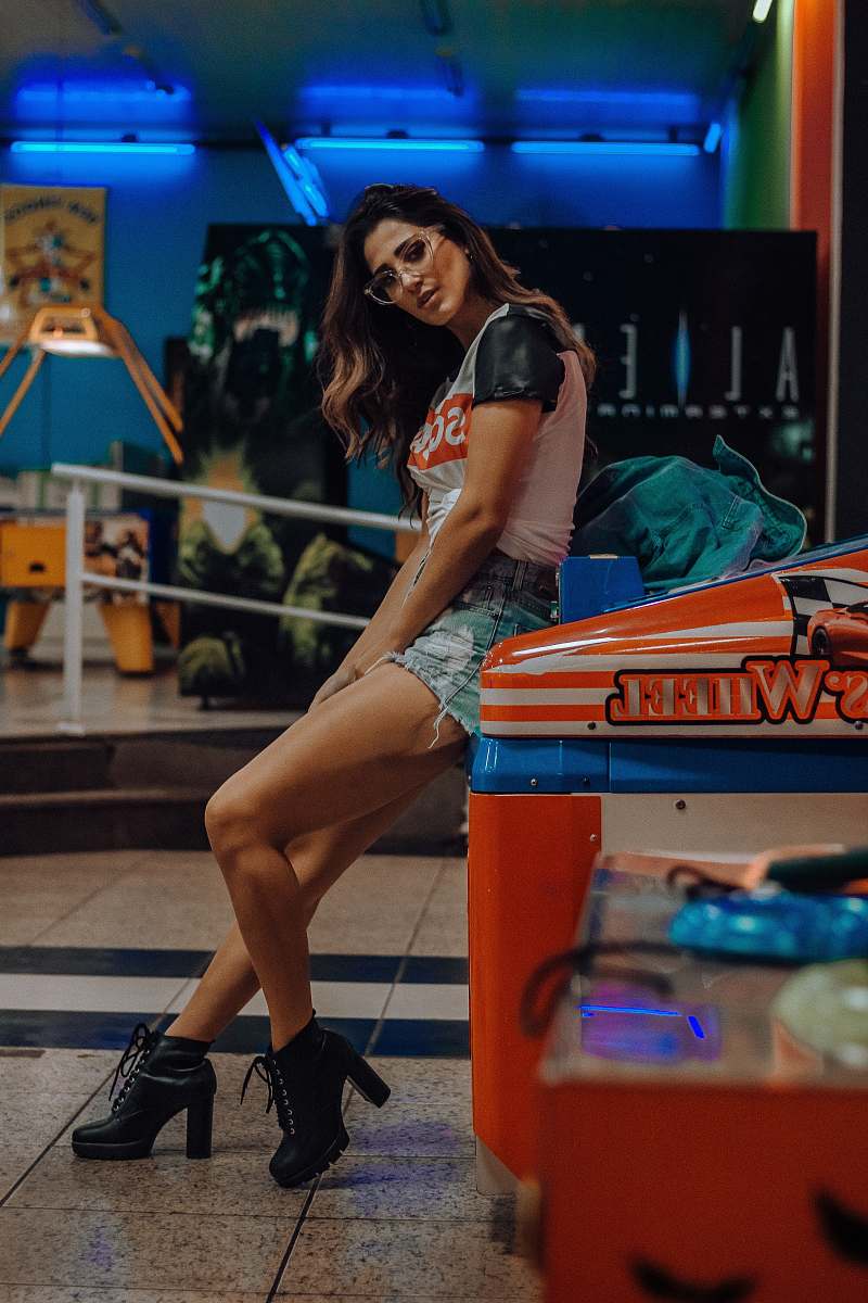people woman sitting on arcade machine human