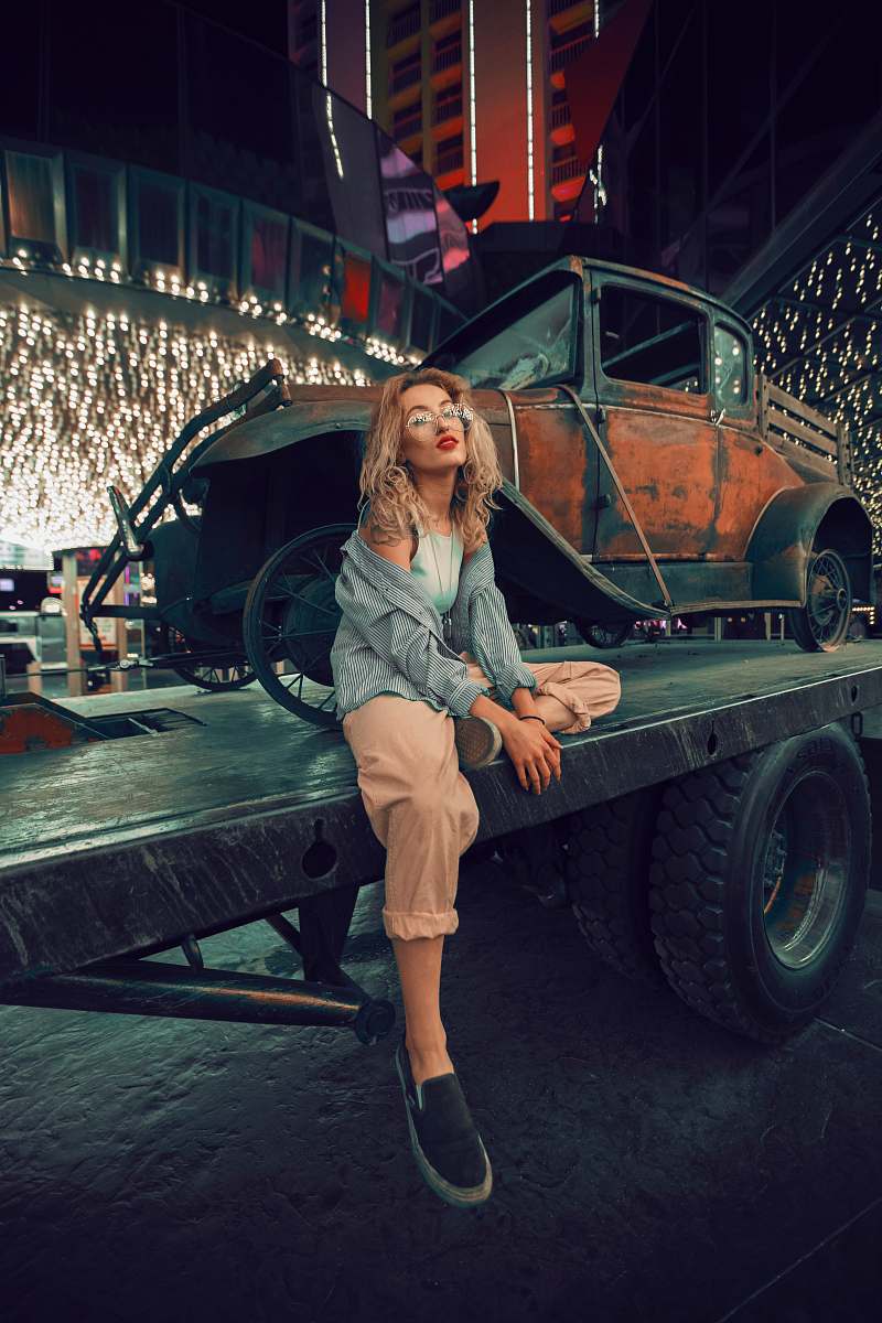 people woman sitting on utility trailer during night car