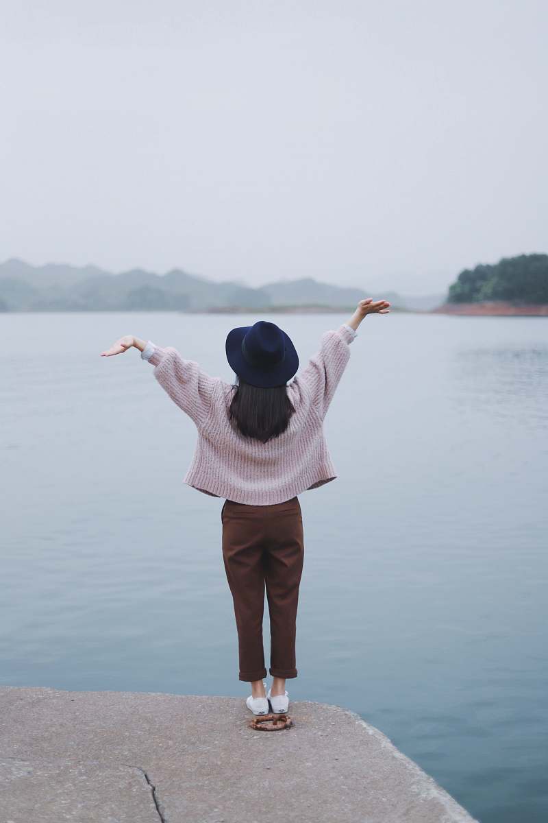 people woman standing beside body of water human
