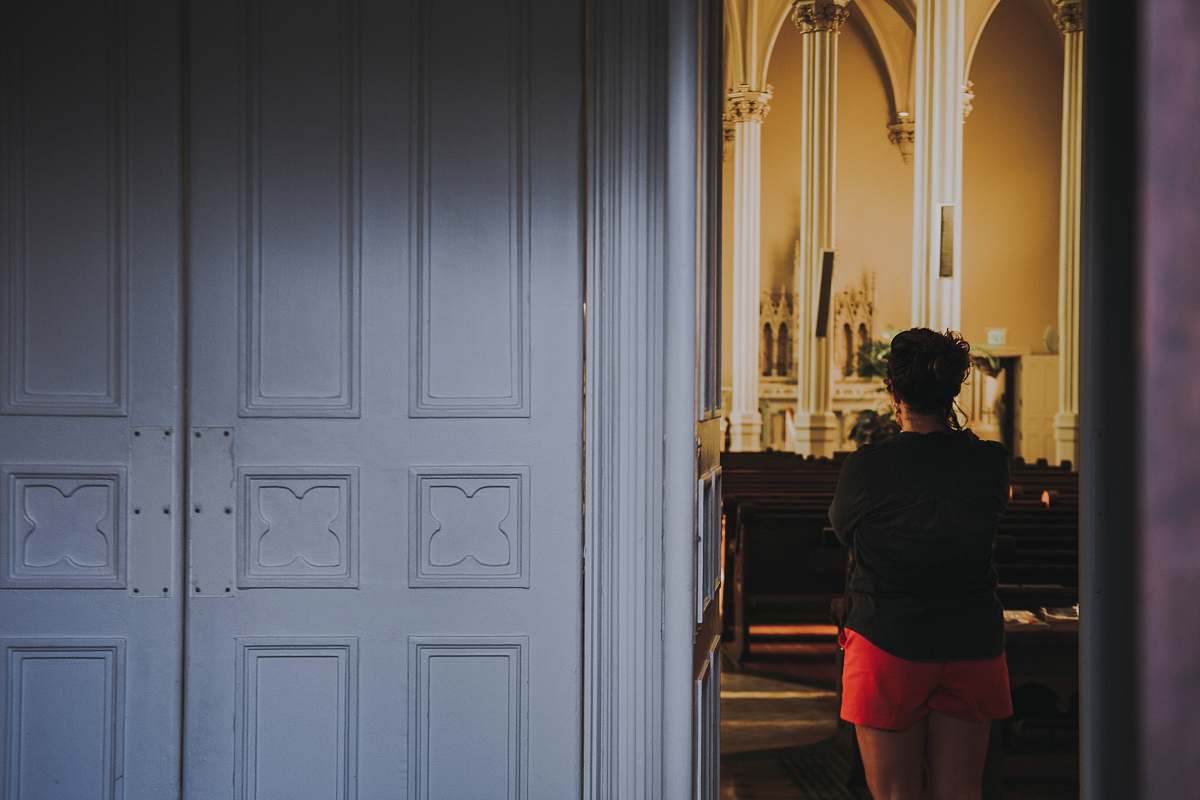 human woman standing beside white door people