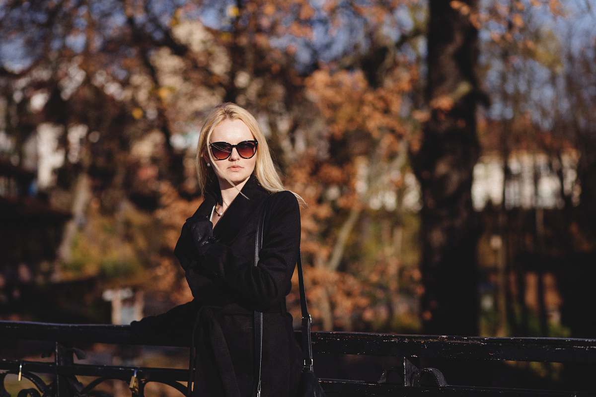 human woman standing in front of bridge people