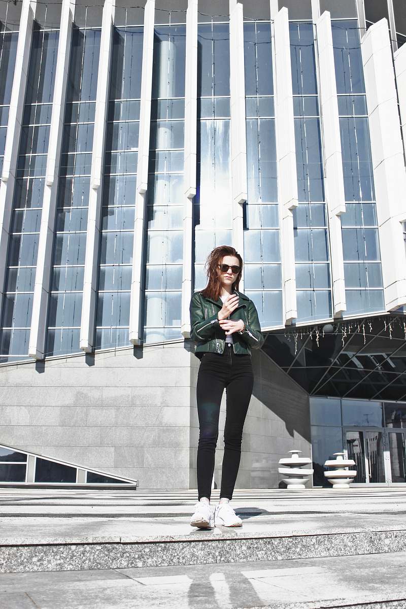 human woman standing in front of building people