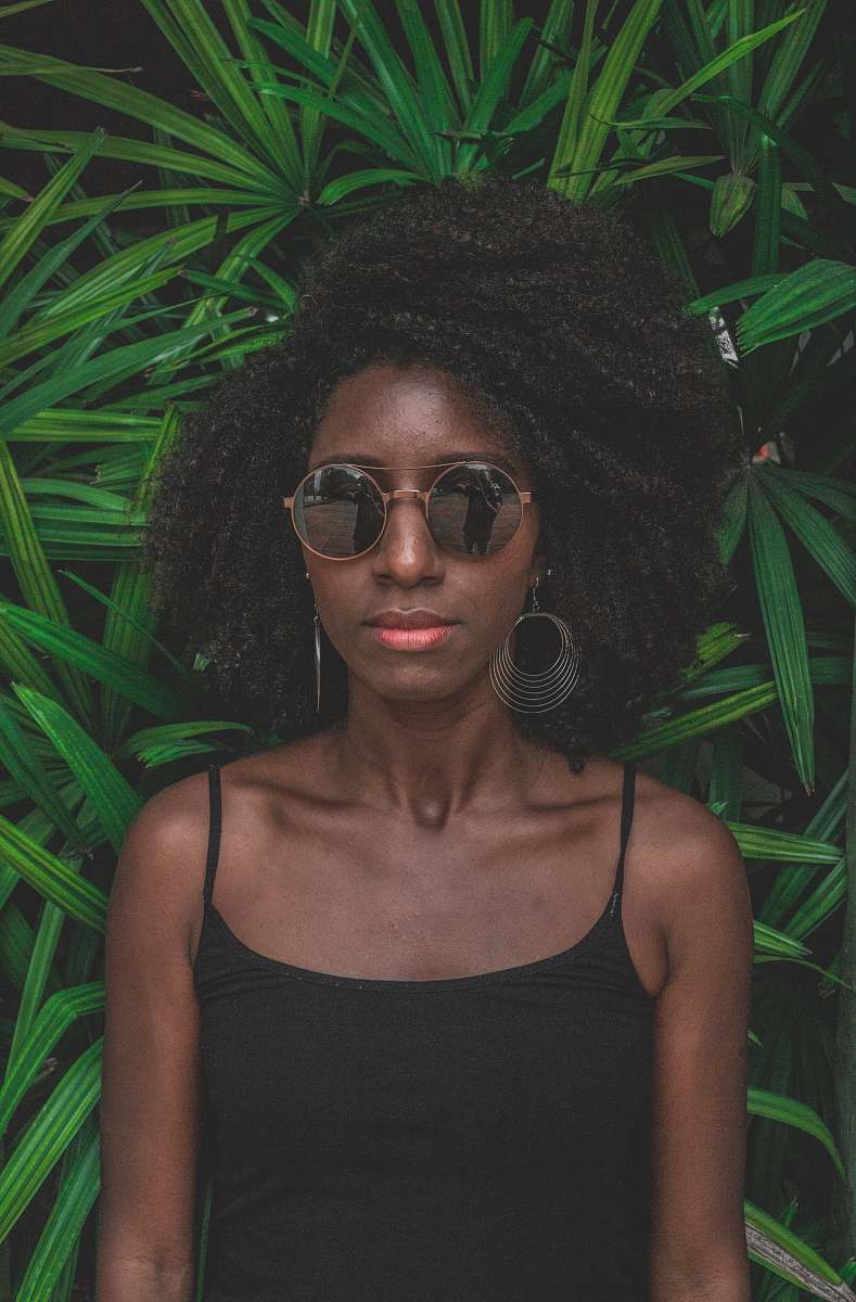 human woman standing in front of green plant people
