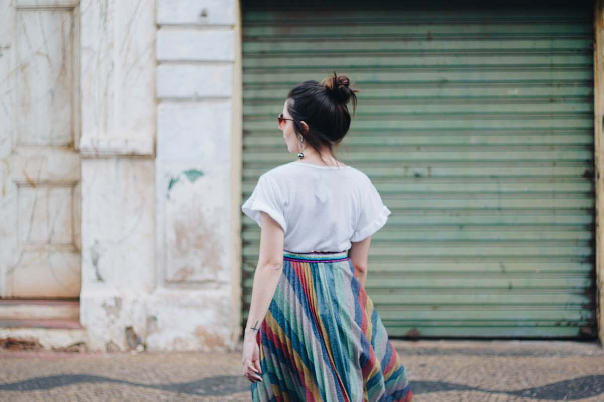 human woman standing in front of green roller-shutter people