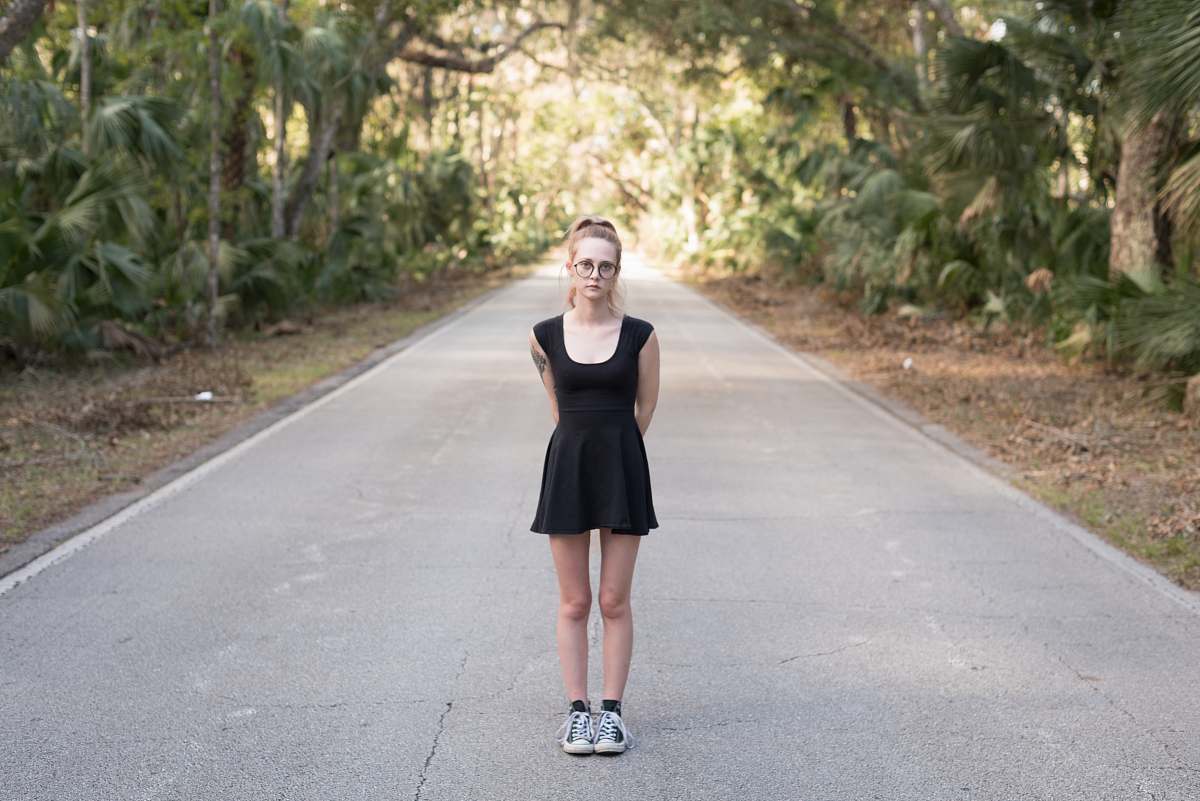 people woman standing in the middle of the road human
