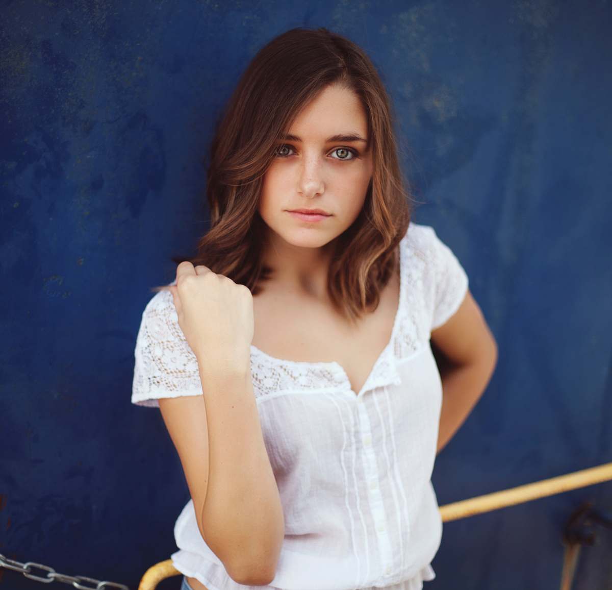human woman standing near blue wall people