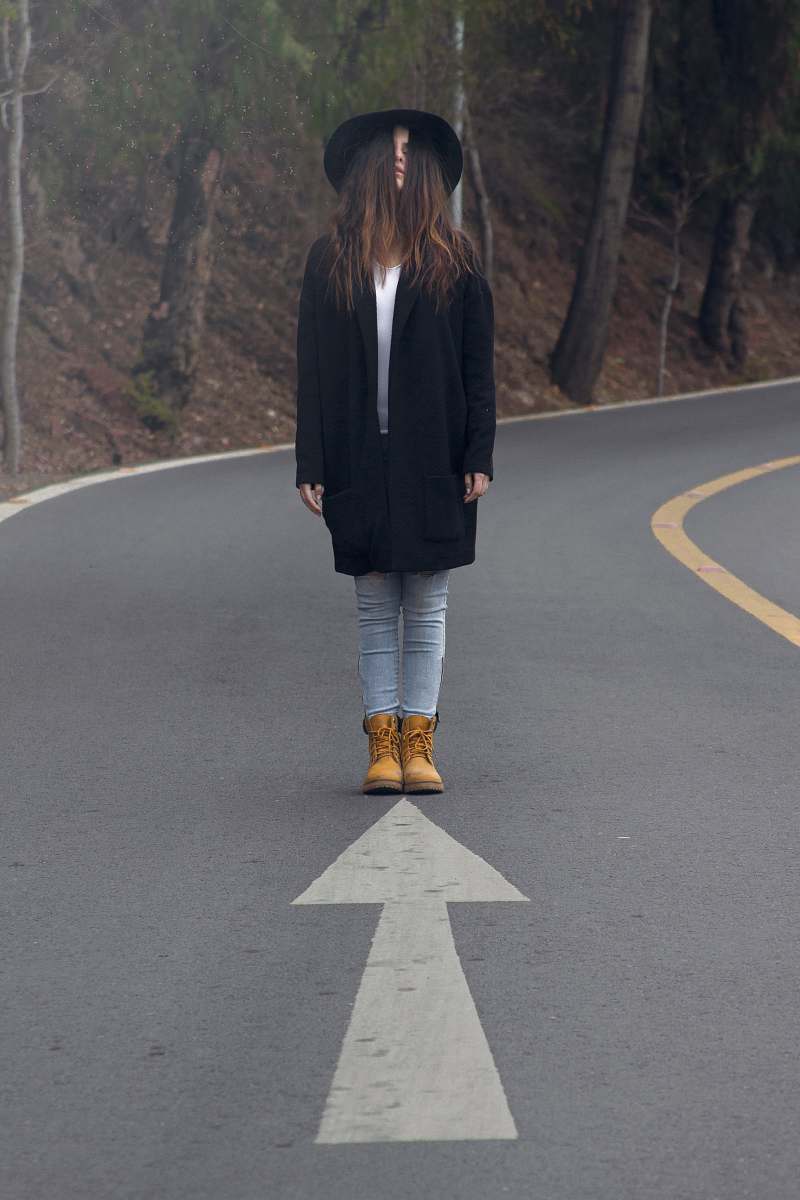 people woman standing on asphalt road standing