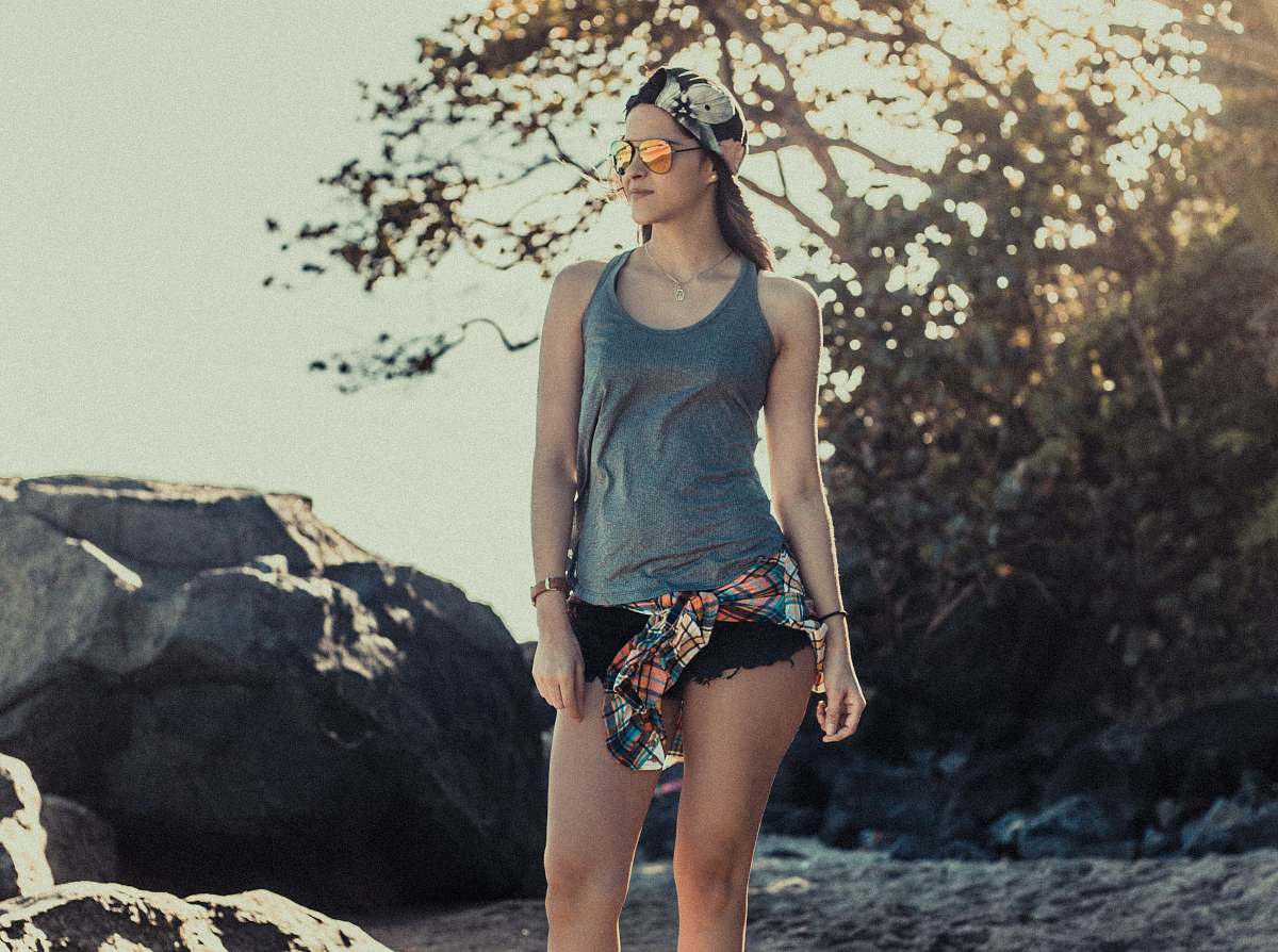 people woman standing on sand during daytime human