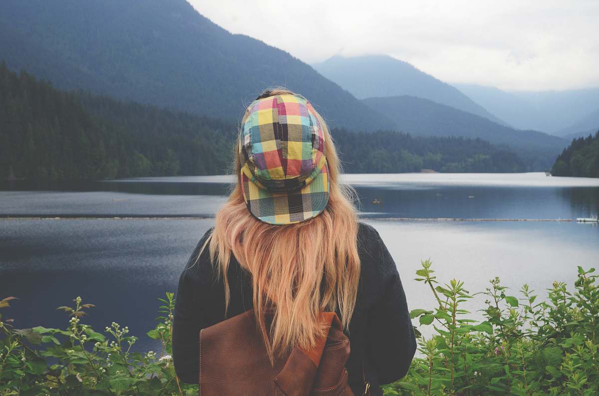 people woman staring body of water girl