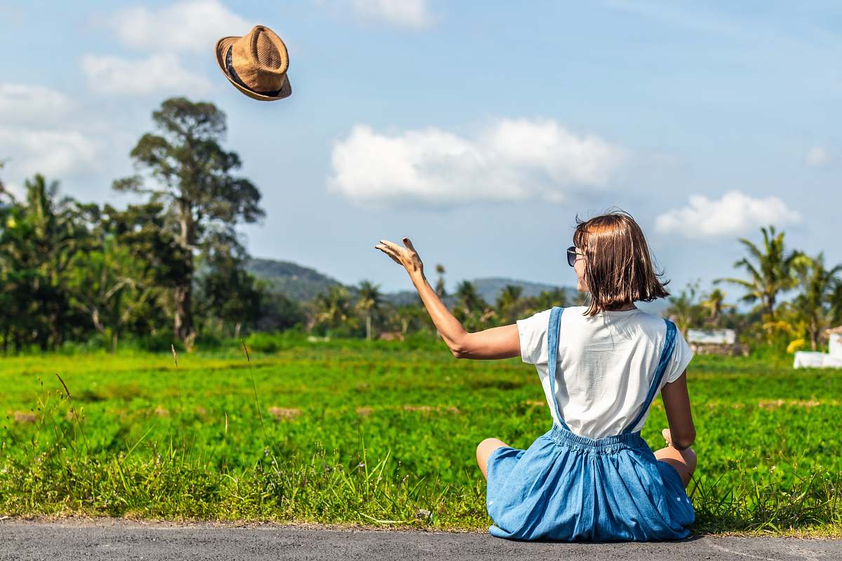 human woman throwing up brown hat people