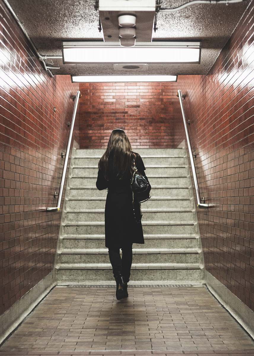 people woman walking near staircase human