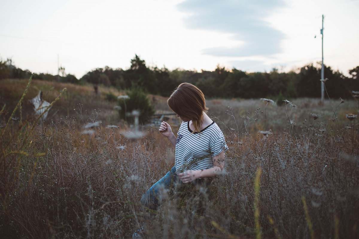 people woman walking on brown leaf plant at daytie human