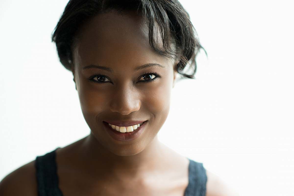 human woman wearing black tank top against white background people