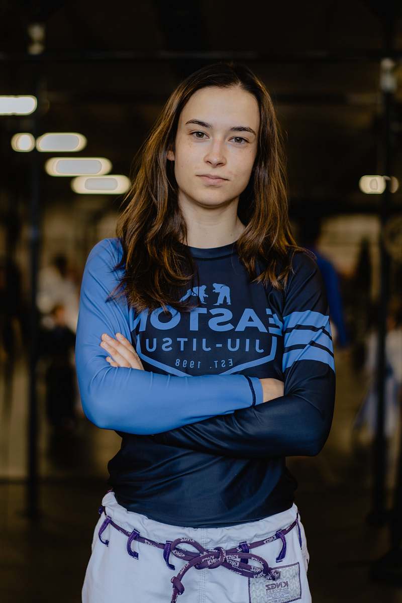 human woman wearing blue and black rashguard people