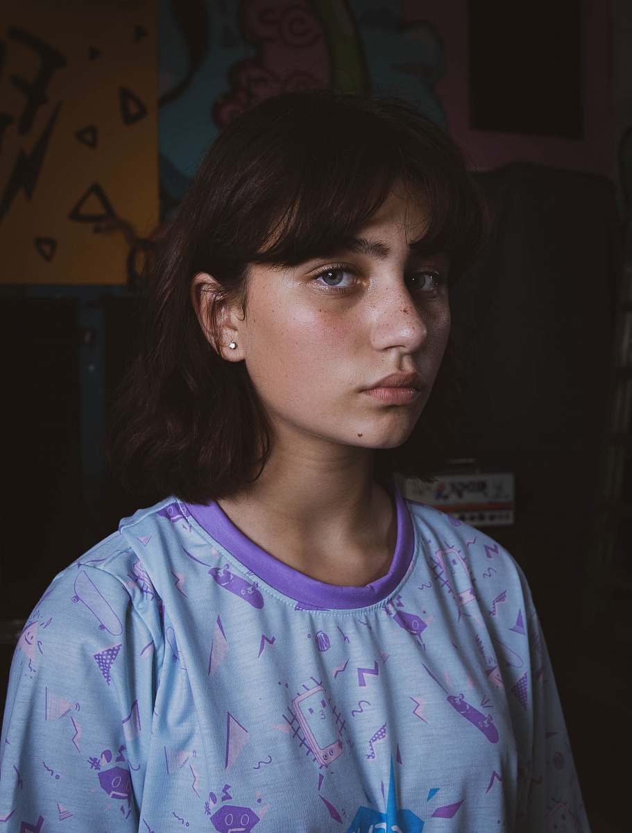 people woman wearing blue and purple shirt human