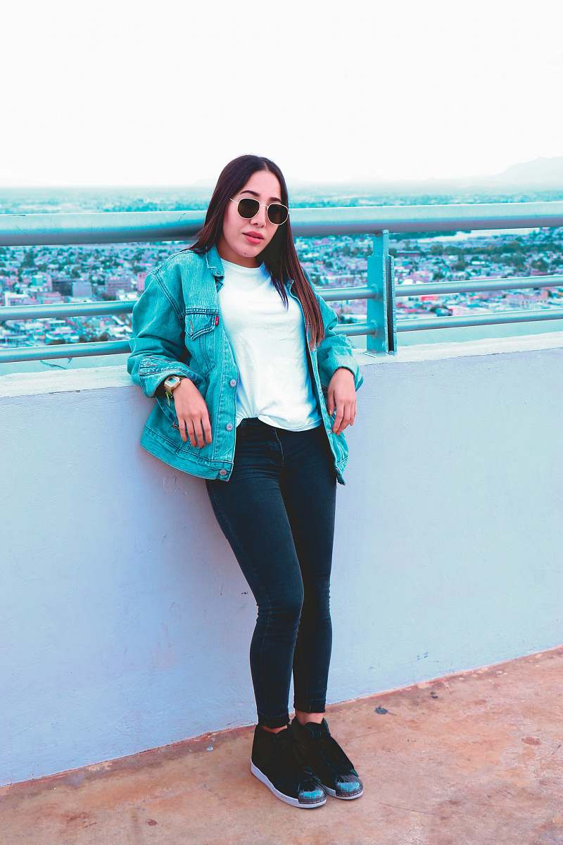people woman wearing blue denim jacket and black denim jeans human