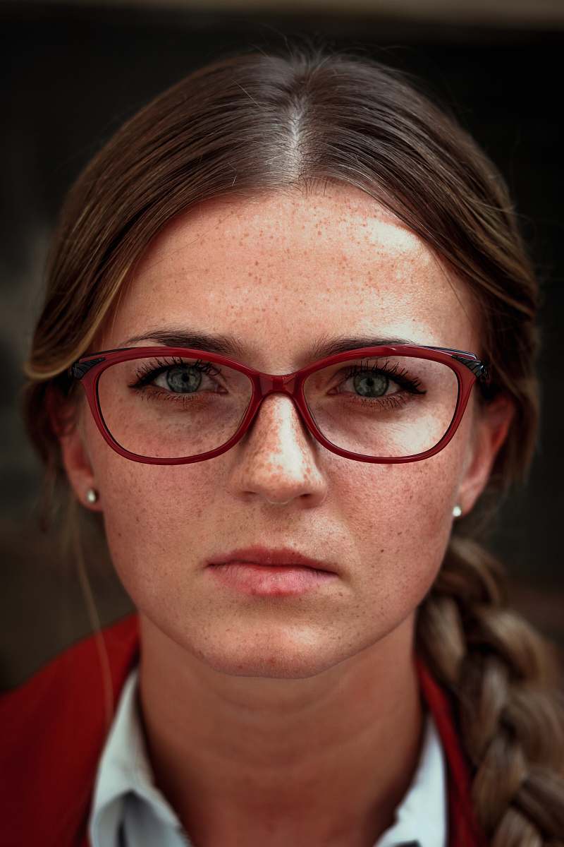 people woman wearing eyeglasses with red frames glasses