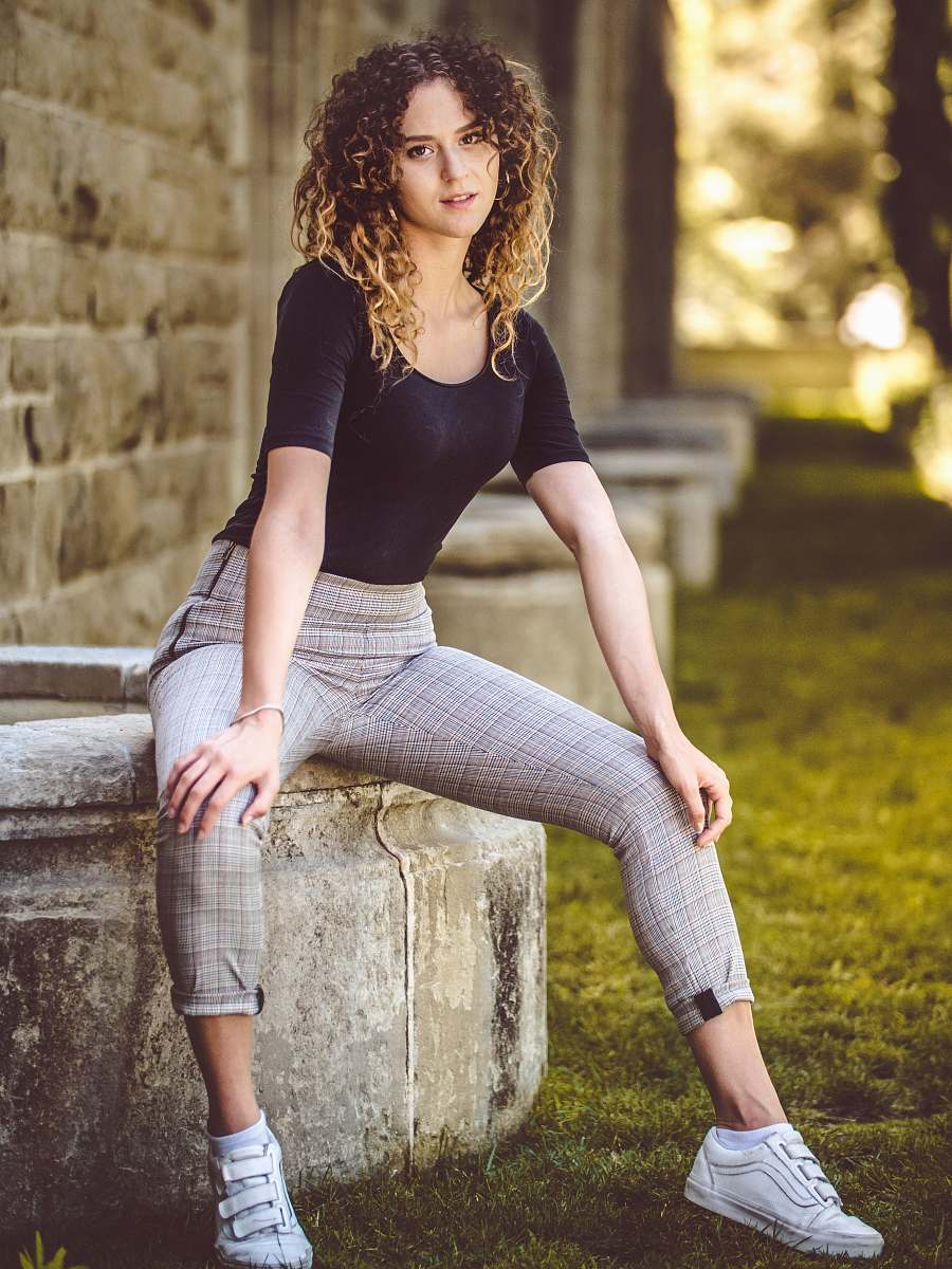 human women's black crew-neck shirt and gray pants people