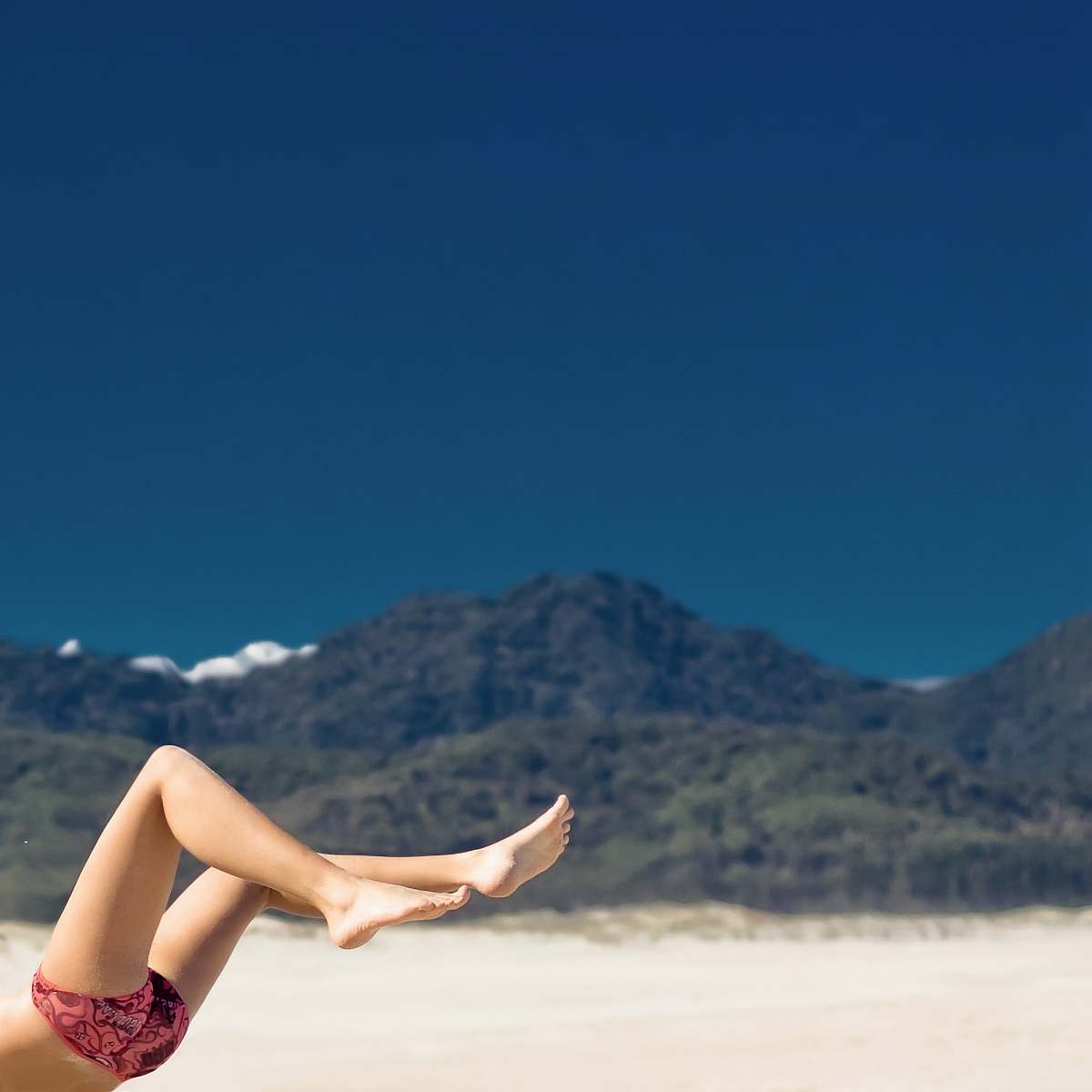 beach selective focus photography of woman on seashore beach wallpapers