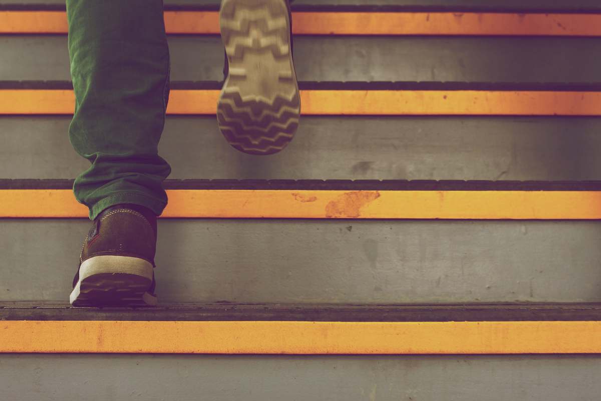 feet person wearing green pants steps