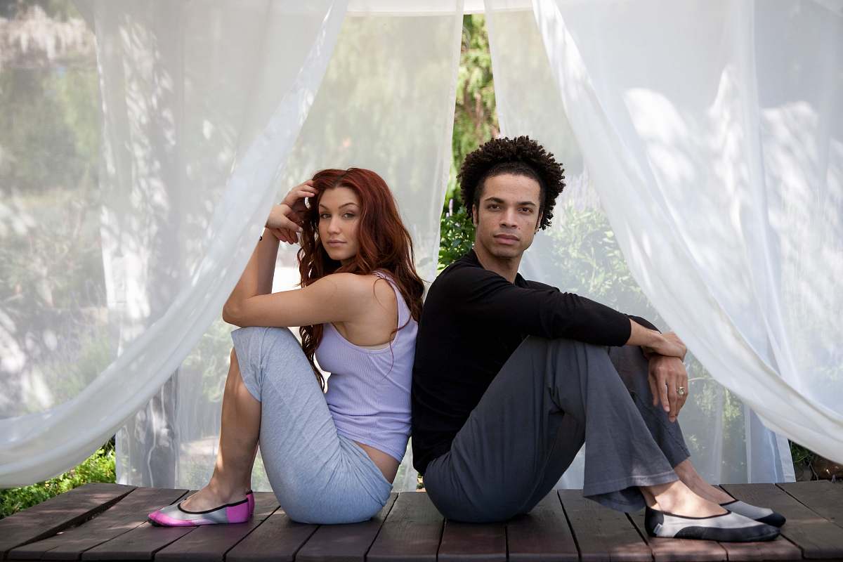 human man and woman sitting inside canopy person
