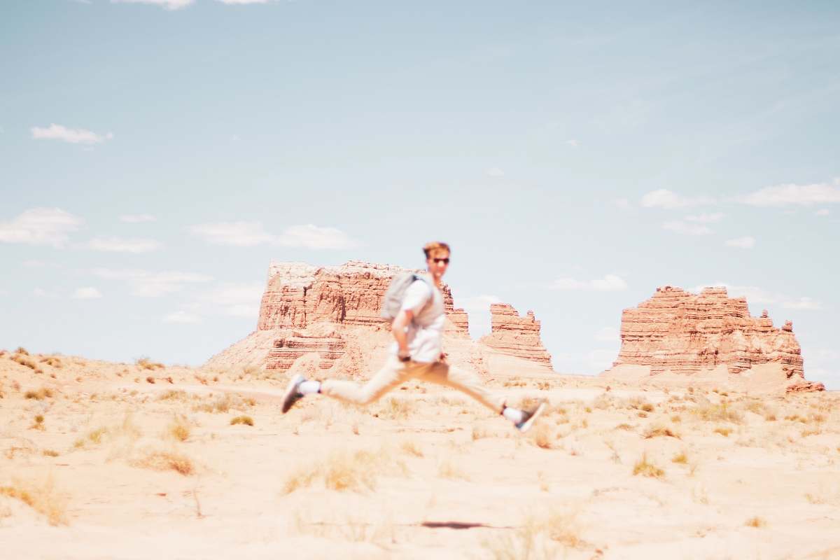 clothing man hopping under clear blue sky shorts