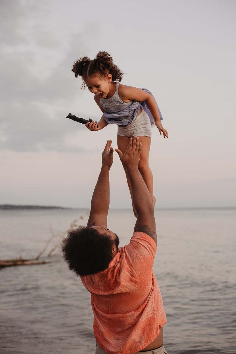 clothing man in pink shirt lifting up girl shorts