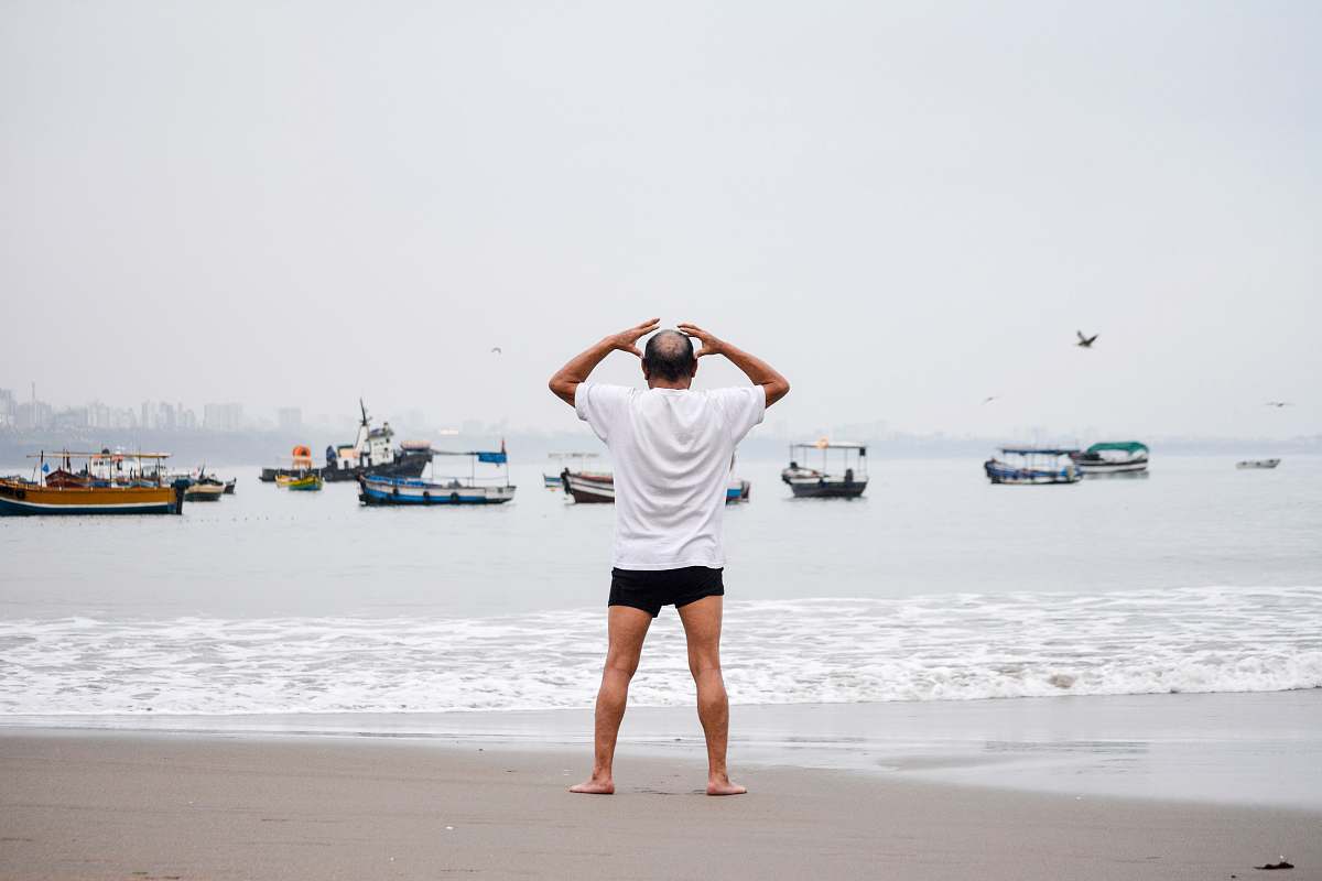 clothing man standing on seashore shorts